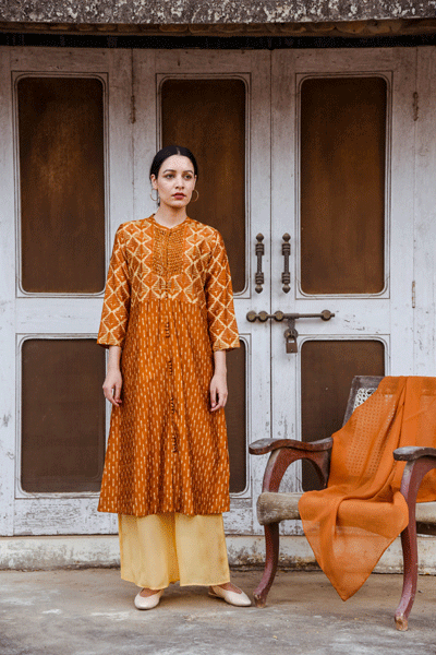 Daydreaming in tan kurta